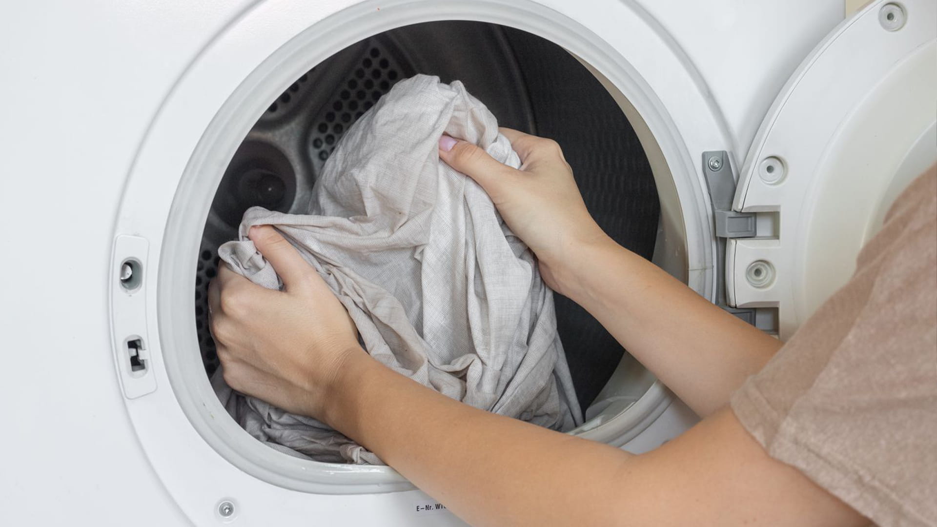 This image shows a professional dry cleaning machine used to clean delicate fabrics like curtains and linens. The front-loading design allows easy handling of garments, while the large capacity supports thorough, gentle dry cleaning. 