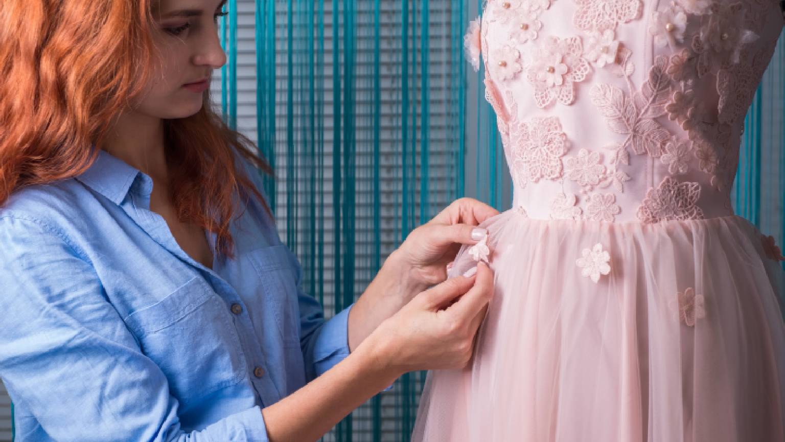 Bridesmaid dress alterations on a pink formal gown with lace detailing